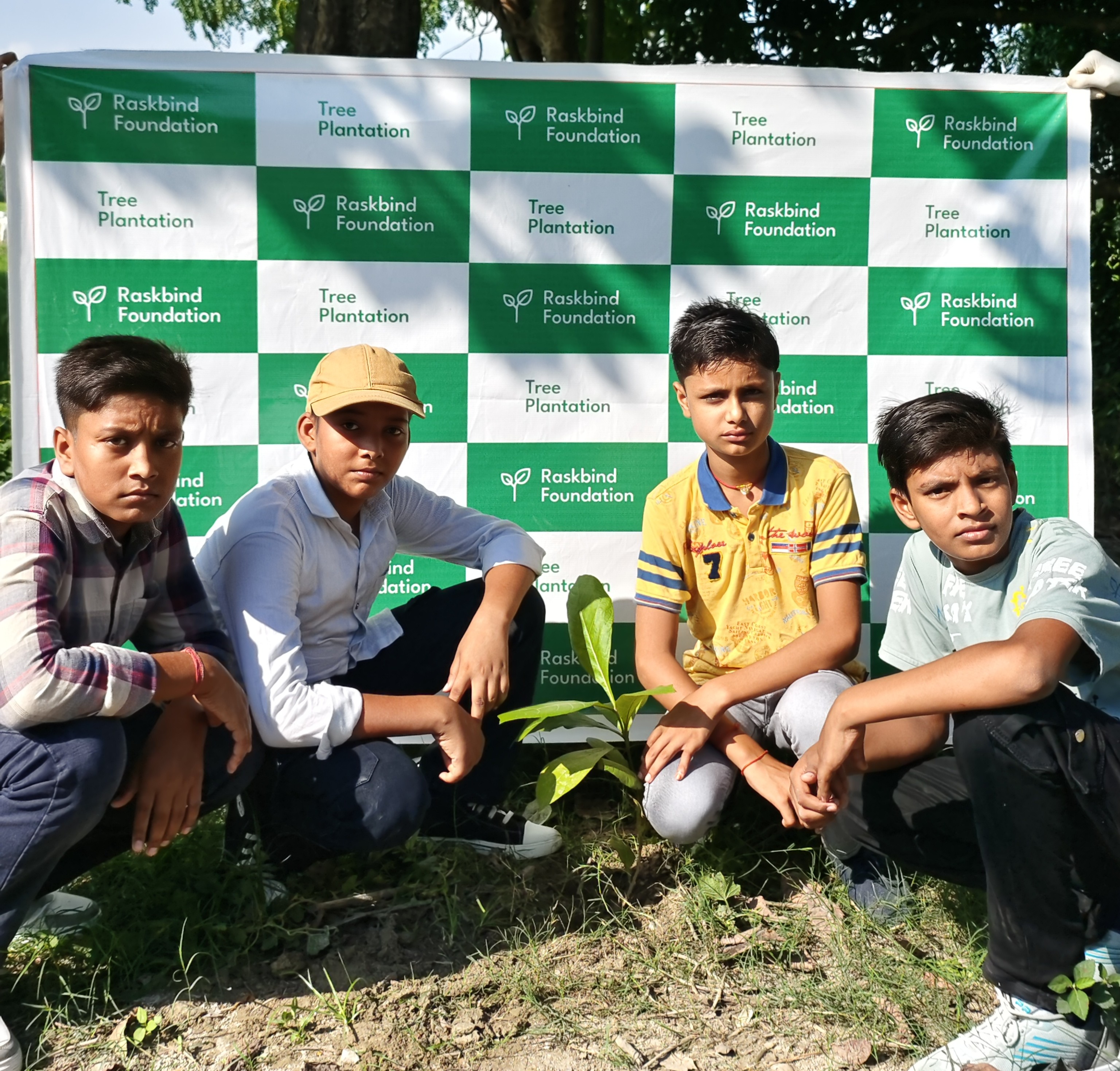 Volunteers planting saplings